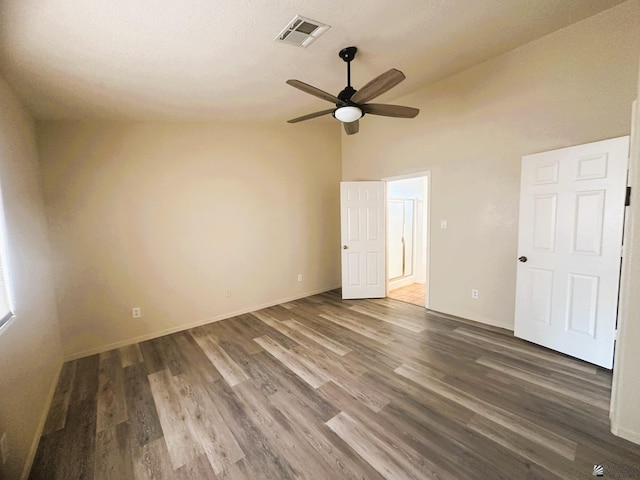 unfurnished bedroom featuring ceiling fan, dark wood finished floors, visible vents, and baseboards