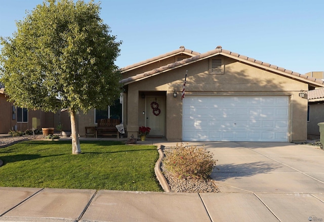 view of front of home featuring a garage and a front yard