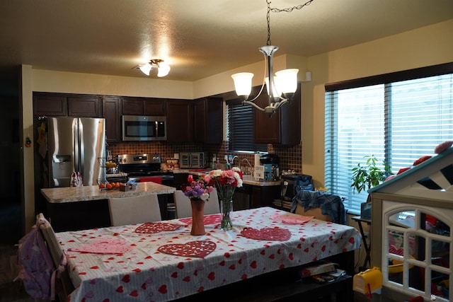 dining area with a notable chandelier