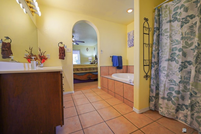 bathroom with ceiling fan, vanity, tile patterned floors, and curtained shower