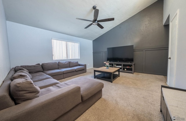 living room with lofted ceiling, light colored carpet, and ceiling fan