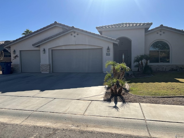 view of front of house with a front yard and a garage