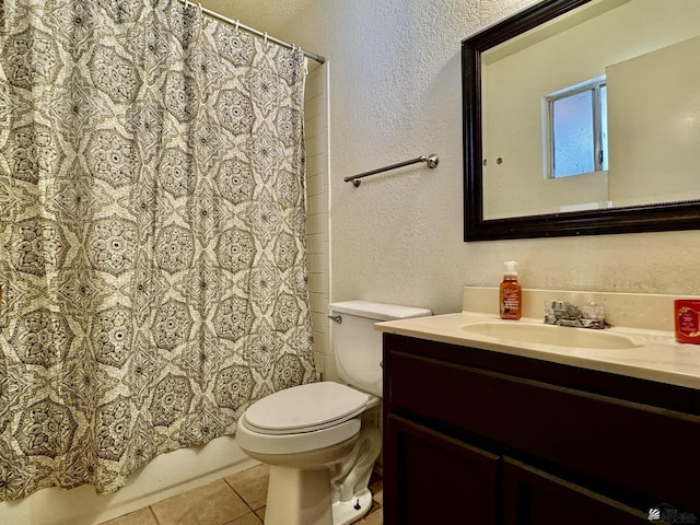 full bathroom featuring tile patterned floors, vanity, toilet, and shower / tub combo