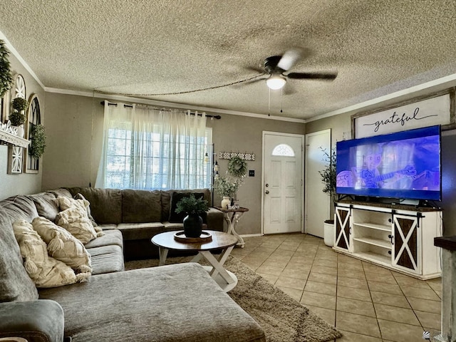 tiled living room with a textured ceiling, ceiling fan, and crown molding