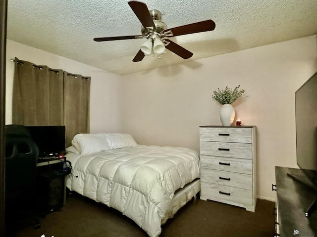 carpeted bedroom with ceiling fan and a textured ceiling