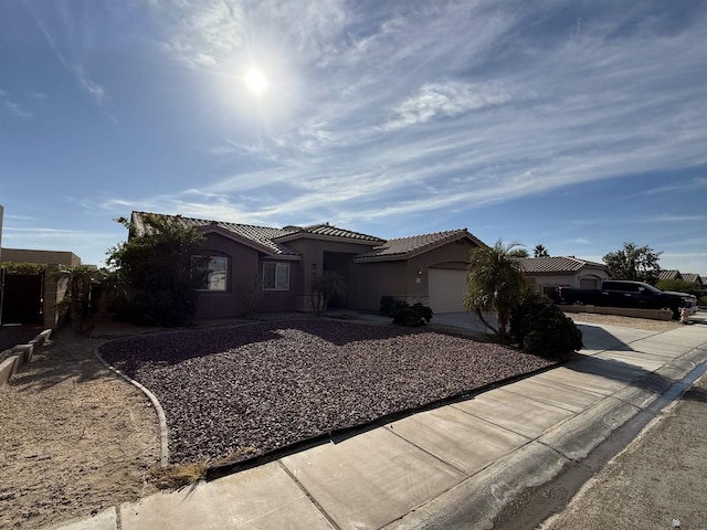 view of front of property with a garage