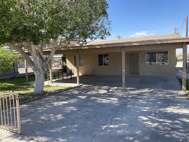 ranch-style house with a carport