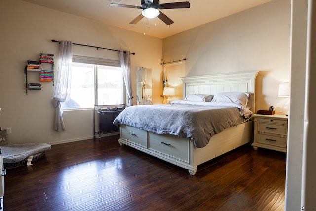 bedroom featuring baseboards, ceiling fan, and dark wood-style flooring