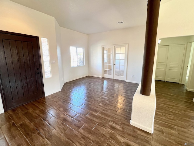 foyer with dark hardwood / wood-style flooring