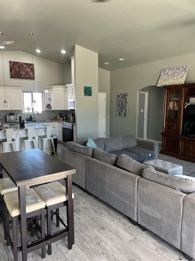 living room with lofted ceiling