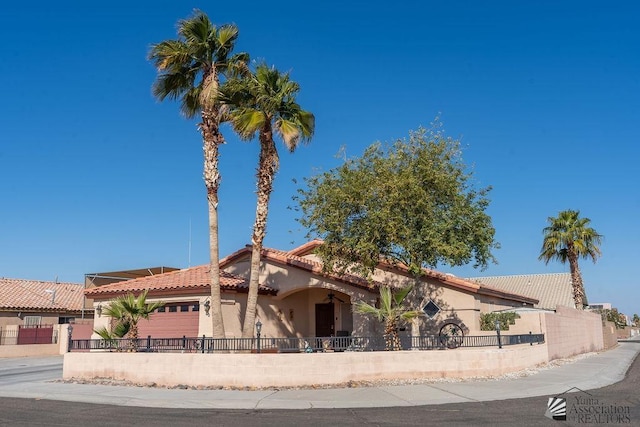 view of front of property with a garage