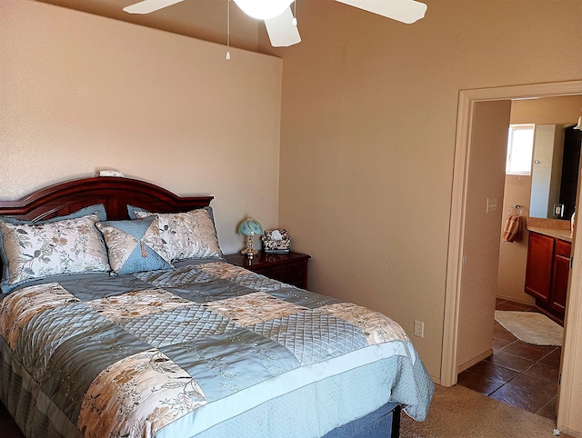 bedroom featuring tile patterned flooring, a ceiling fan, and carpet flooring