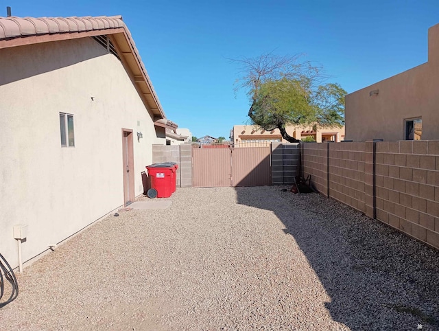 view of yard featuring a gate and fence