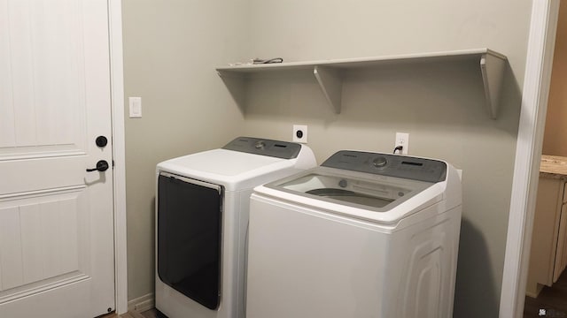 clothes washing area featuring washing machine and dryer