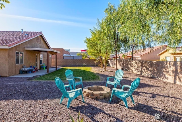 view of yard featuring a patio area and a fire pit