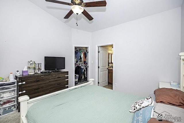 bedroom with ceiling fan, a closet, vaulted ceiling, and ensuite bathroom