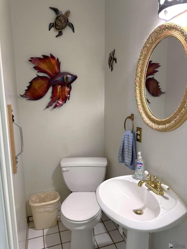 bathroom featuring tile patterned floors, sink, and toilet