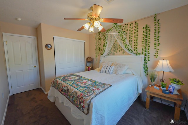 bedroom with a closet, baseboards, ceiling fan, and carpet flooring