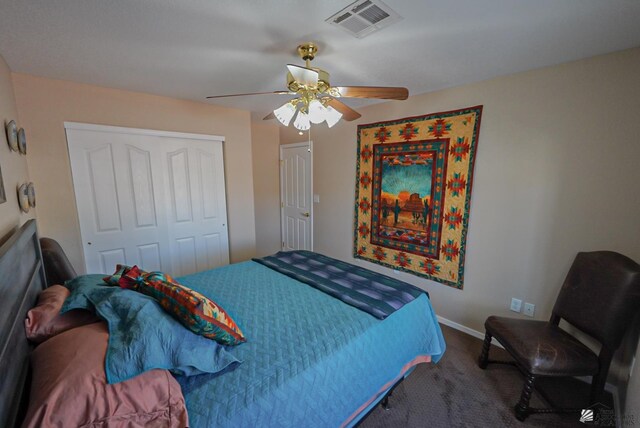 carpeted bedroom with a ceiling fan, visible vents, a closet, and baseboards