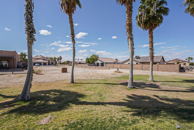 view of yard with fence and a residential view