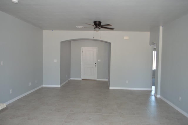 unfurnished room featuring ceiling fan