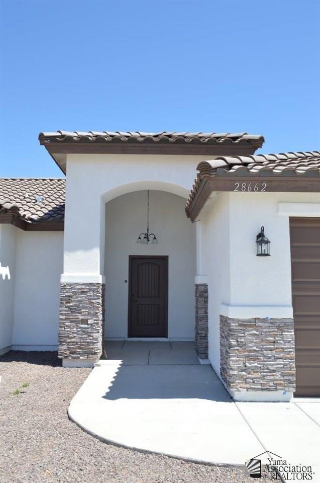 property entrance featuring a garage