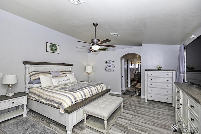 bedroom featuring hardwood / wood-style floors and ceiling fan