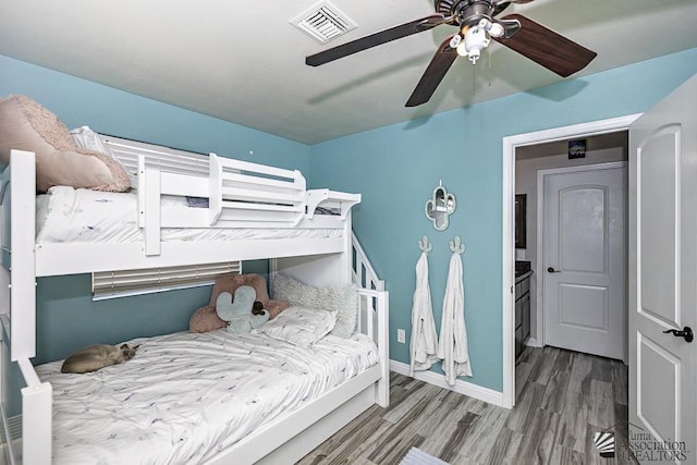 bedroom with ceiling fan and hardwood / wood-style floors