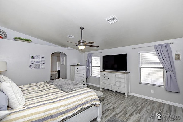 bedroom featuring lofted ceiling, light hardwood / wood-style floors, and ceiling fan