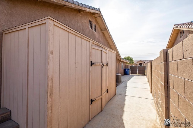 view of side of property with central air condition unit