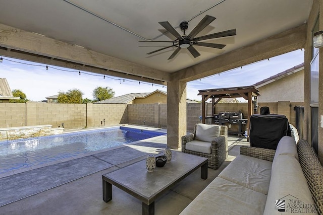 view of pool featuring a patio, outdoor lounge area, a grill, and ceiling fan