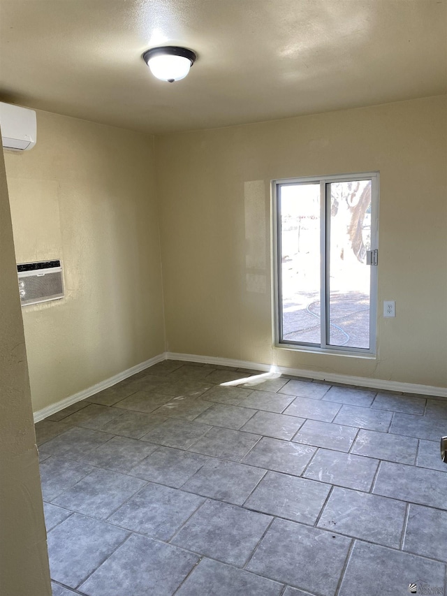 empty room featuring a wall mounted air conditioner