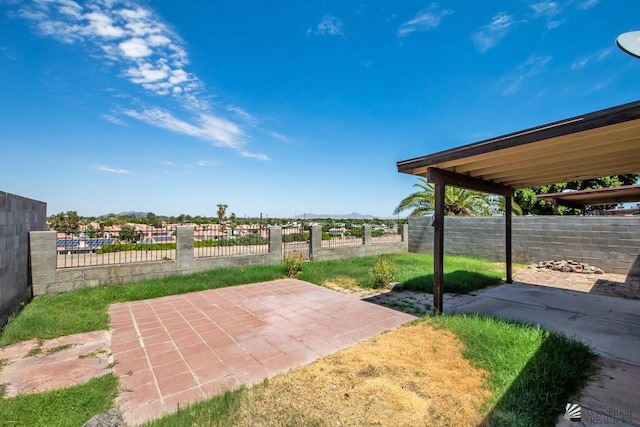 view of patio featuring fence