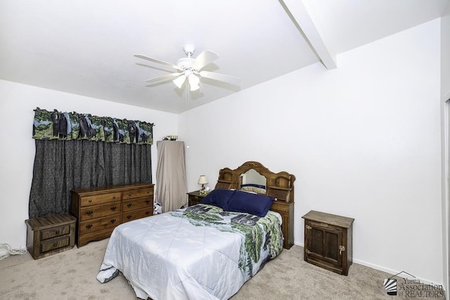 bedroom with beam ceiling, light colored carpet, and ceiling fan