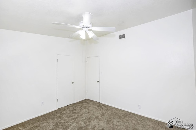 carpeted empty room with ceiling fan