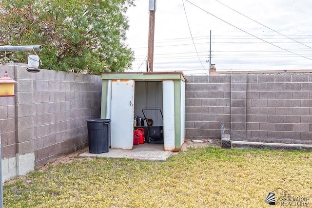 view of outdoor structure with a lawn