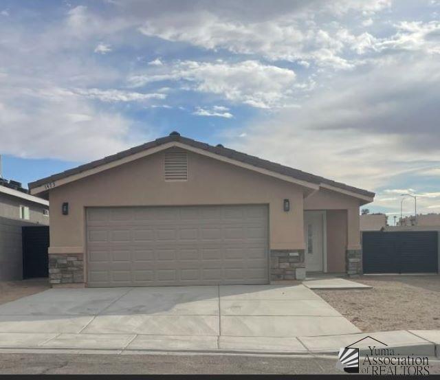 single story home with a garage