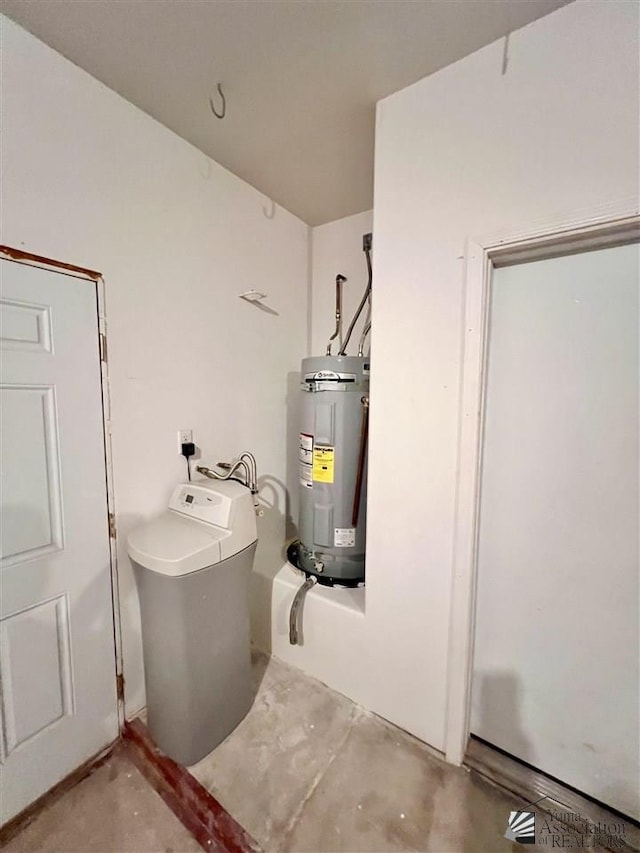 utility room featuring water heater