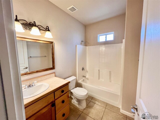 full bathroom with tile patterned floors, vanity, shower / bathtub combination, and toilet