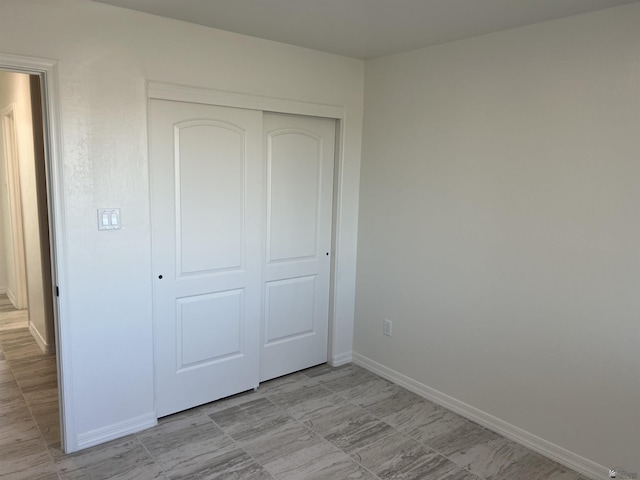 unfurnished bedroom featuring a closet