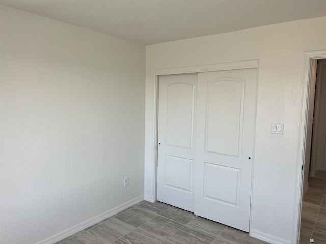 unfurnished bedroom featuring a closet