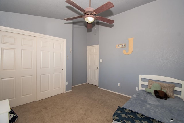 bedroom with vaulted ceiling, carpet floors, a ceiling fan, and baseboards