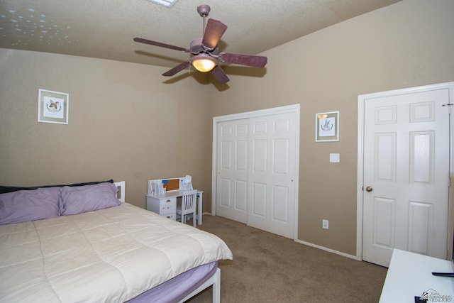 carpeted bedroom featuring ceiling fan, a closet, and baseboards