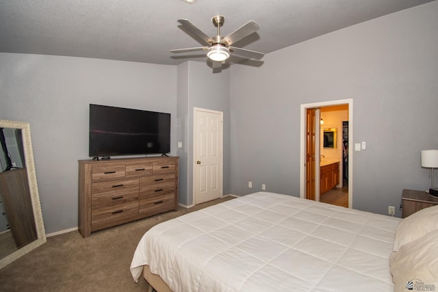 carpeted bedroom featuring connected bathroom, vaulted ceiling, and ceiling fan