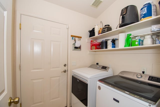 laundry room featuring laundry area, visible vents, and independent washer and dryer