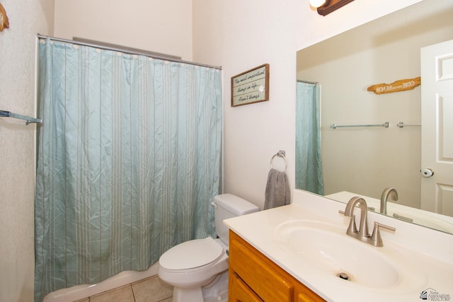 bathroom featuring toilet, curtained shower, vanity, and tile patterned floors