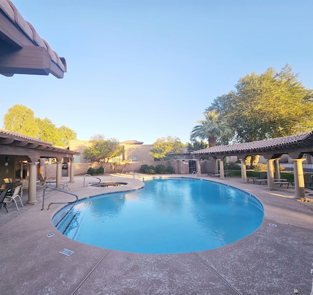 view of swimming pool featuring a patio area