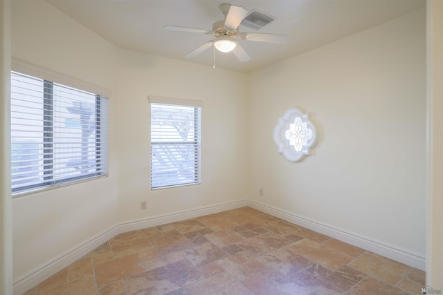 unfurnished room with ceiling fan