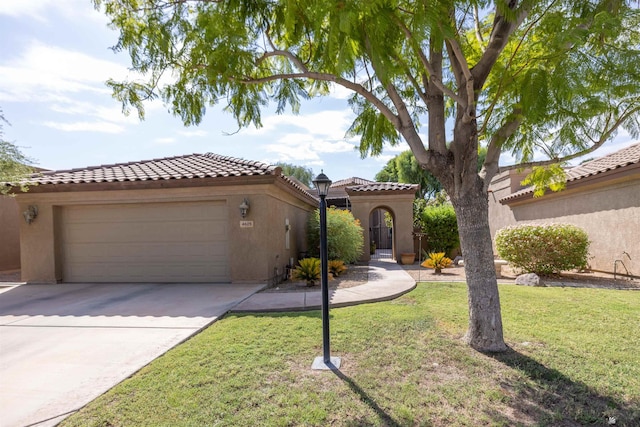 mediterranean / spanish home featuring a front yard