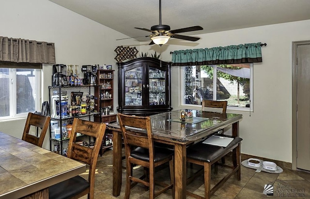 dining space featuring ceiling fan